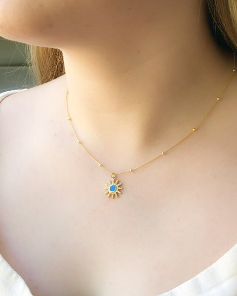 Blue Fire Opal Pendant strung on a 14k Gold Satellite Chain.